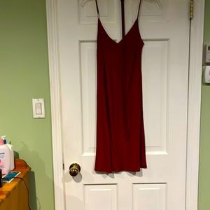 Burgundy fitted size38 satin cocktail dress with belt and slip.